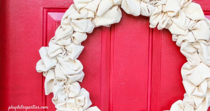DIY canvas drop cloth wreath on a red door