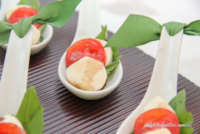 Mini caprese bites in appetizer spoons