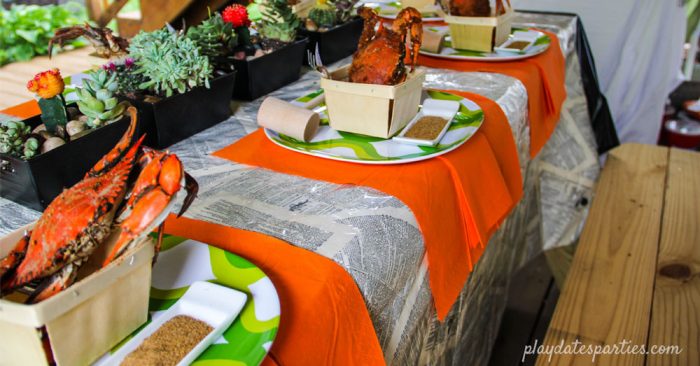 A modern crab feast with place settings ready for the guests.