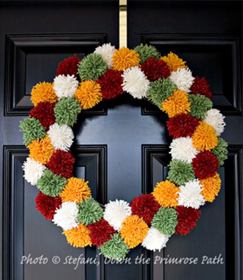 5 Clever and Colorful Fall Wreaths: A pom pom wreath makes me want to curl up under a blanket with a cup of hot cocoa!