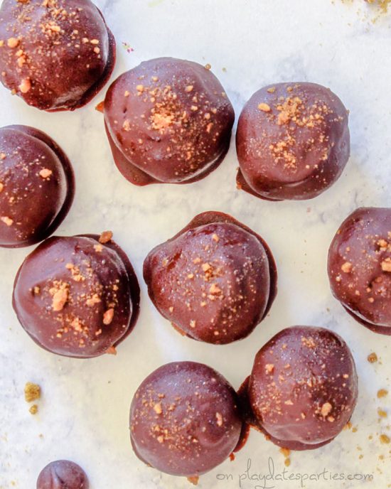 chocolate pumpkin truffles garnished with gingersnaps