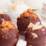 Pumpkin truffles with both dark and white chocolate candy shells.