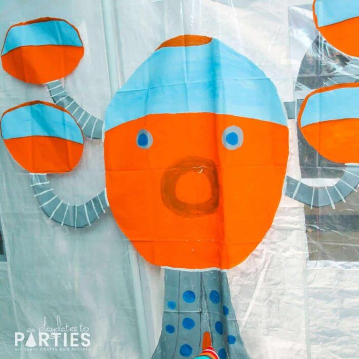 Hand painted octopod on a clear shower curtain as party decor