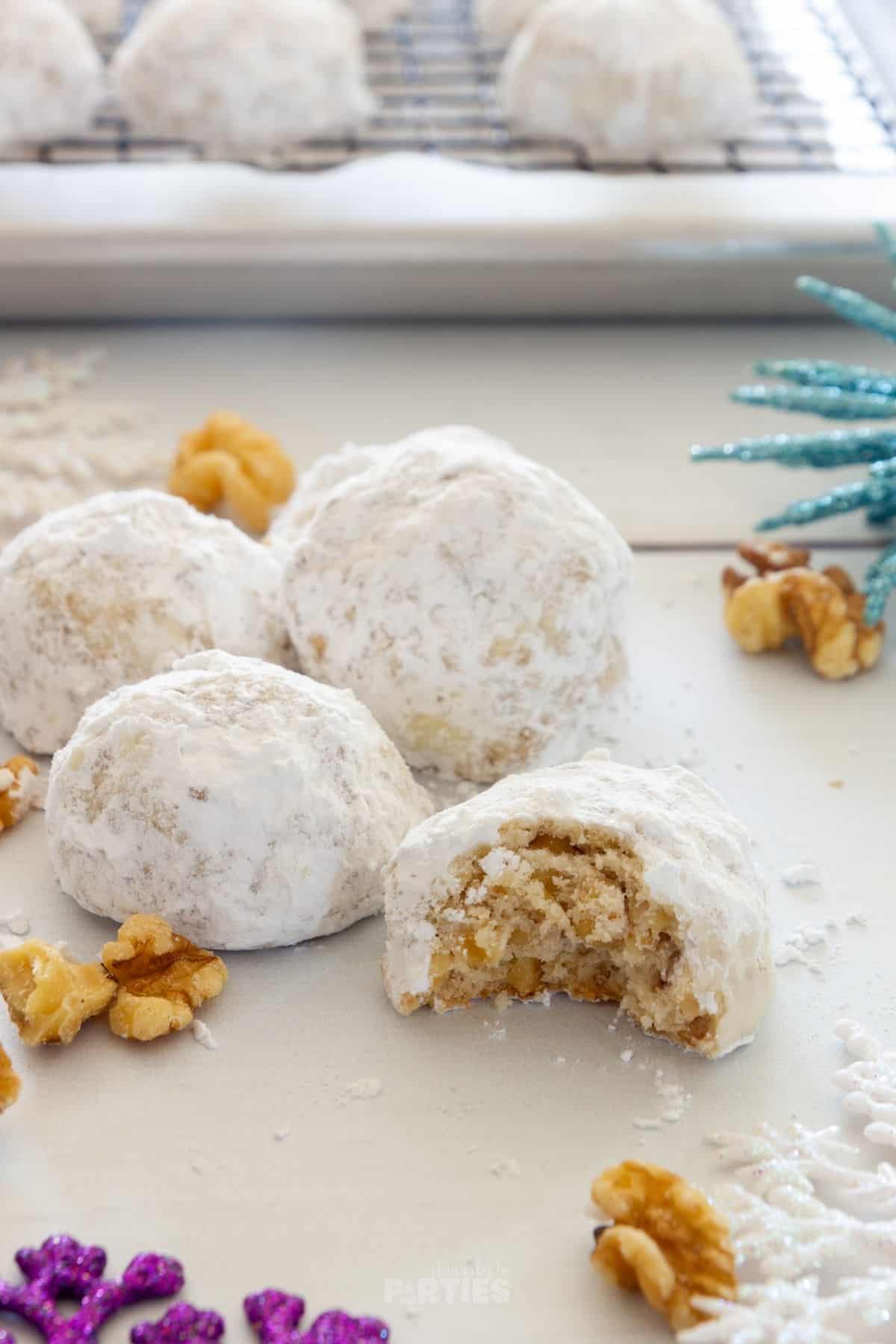 Perfectly tender and coated with powdered sugar, snowballs with walnuts are a delicious holiday cookie.