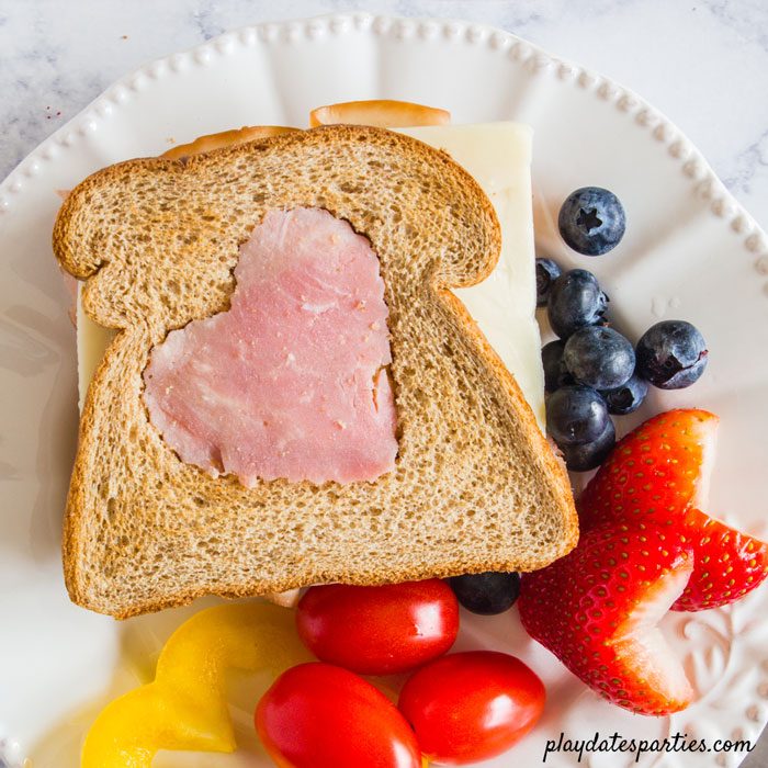 sandwich with a heart shaped ham cutout on top