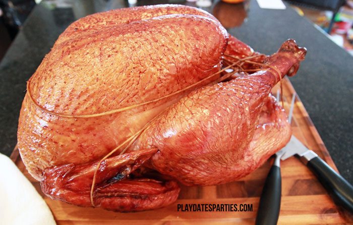 Once you've learned how to grill a turkey on a charcoal grill you can get a beautifully smoked turkey like this.