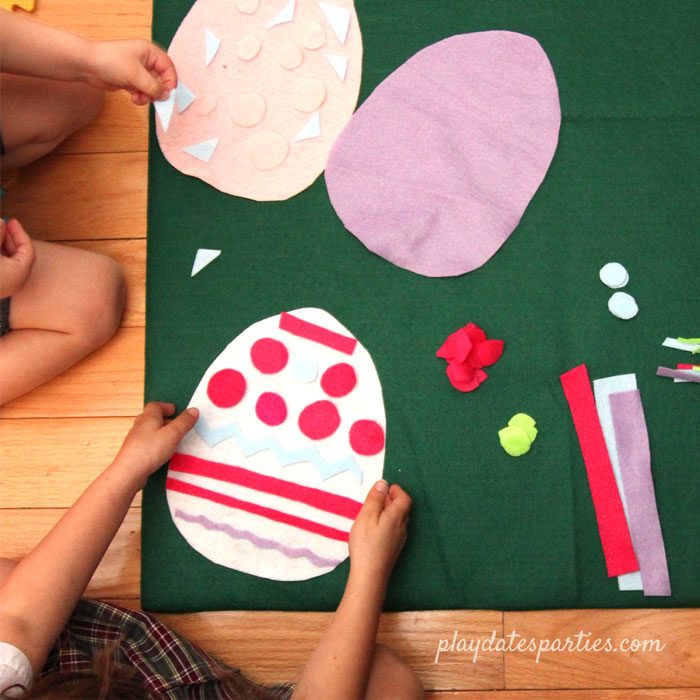 kids playing with felt Easter eggs