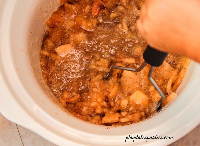 Choose your own consistency with slow cooker applesauce by mashing with a potato masher or using an immersion blender.