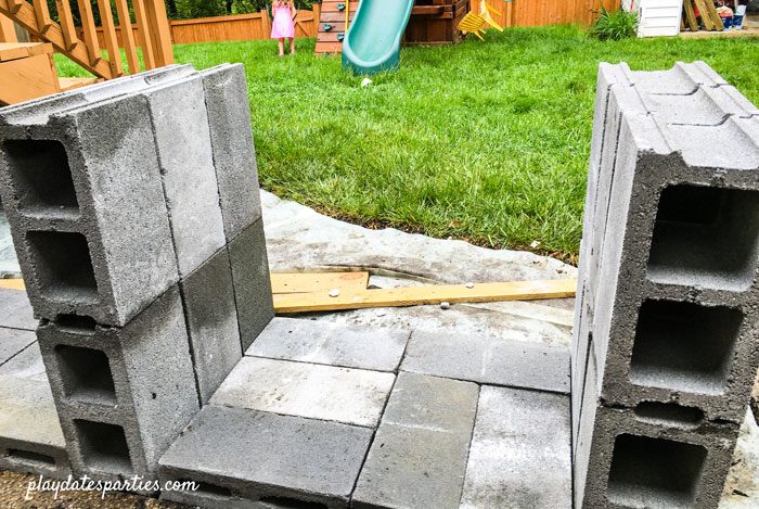 Cinder block legs and base for the DIY outdoor bar in place.