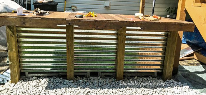 DIY outdoor bar with the corrugated steel front.