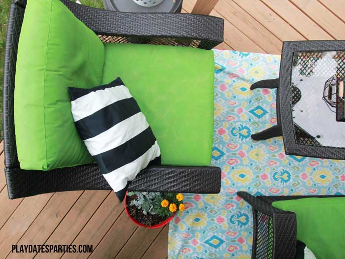 Take a look at this backyard renovation, with loads of DIY projects to get your backyard ready for summer entertaining. Projects include a homemade pallet bar, painted patio cushions, painted patio furniture, a DIY privacy screen, outdoor lighting and more!