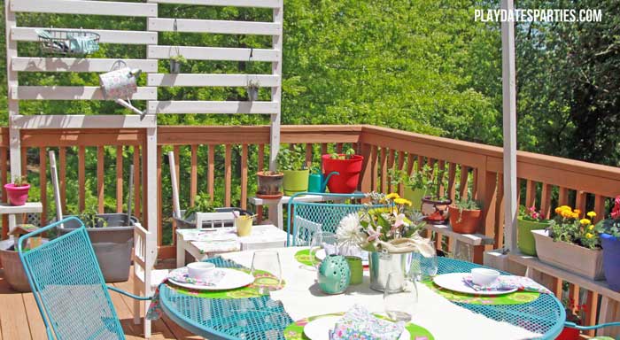 Take a look at this backyard renovation, with loads of DIY projects to get your backyard ready for summer entertaining. Projects include a homemade pallet bar, painted patio cushions, painted patio furniture, a DIY privacy screen, outdoor lighting and more!