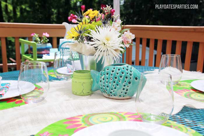 Take a look at this backyard renovation, with loads of DIY projects to get your backyard ready for summer entertaining. Projects include a homemade pallet bar, painted patio cushions, painted patio furniture, a DIY privacy screen, outdoor lighting and more!