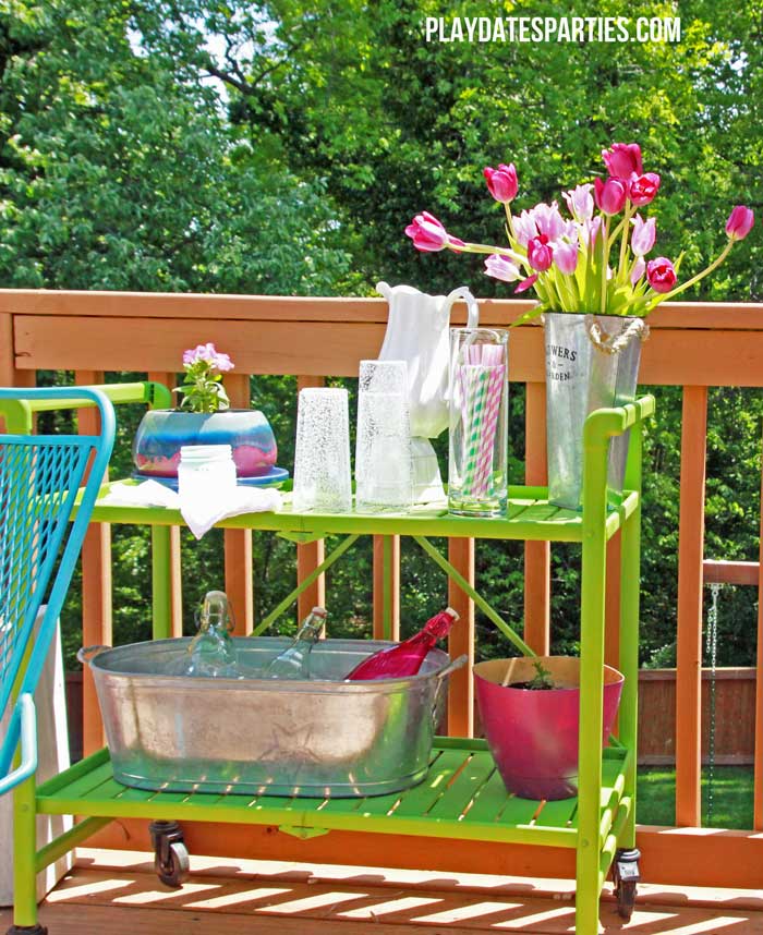 Take a look at this backyard renovation, with loads of DIY projects to get your backyard ready for summer entertaining. Projects include a homemade pallet bar, painted patio cushions, painted patio furniture, a DIY privacy screen, outdoor lighting and more!