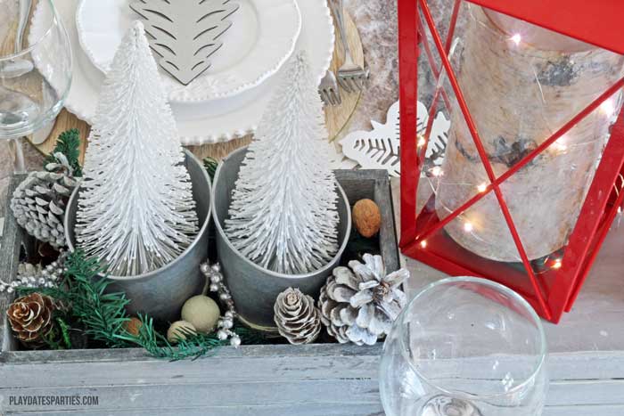 Don't spend a fortune to entertain beautifully! Find out how to make an elegant woodland holiday tablescape you can actually afford to recreate!