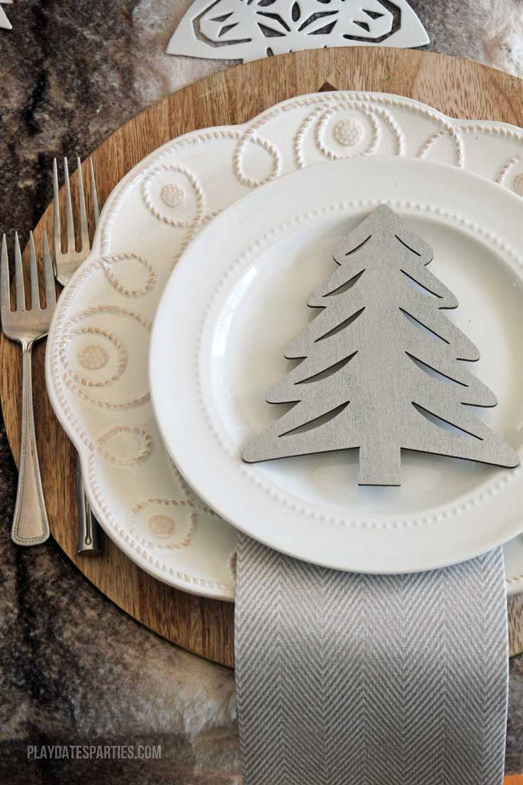 Don't spend a fortune to entertain beautifully! Find out how to make an elegant woodland holiday tablescape you can actually afford to recreate!