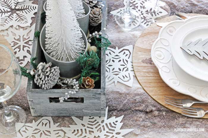 Don't spend a fortune to entertain beautifully! Find out how to make an elegant woodland holiday tablescape you can actually afford to recreate!