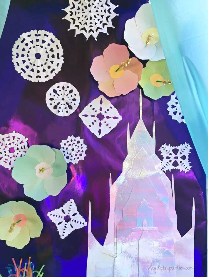 This stunning Frozen luau party is full of easy DIY projects and simple tips that you can absolutely recreate for a special little girl in your life. Including: an Olaf snow flurry, Olaf jello cups, a fake snow beach, a purple and blue ice cream cake, and lots of snowflakes everywhere!