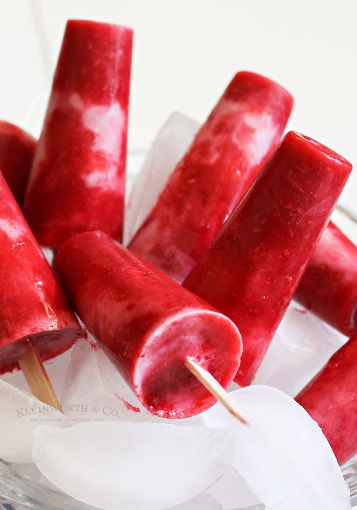 These Raspberry Coconut Pops are so incredibly easy & delicious! The perfect blend of raspberry & coconut in a cool & refreshing pop.