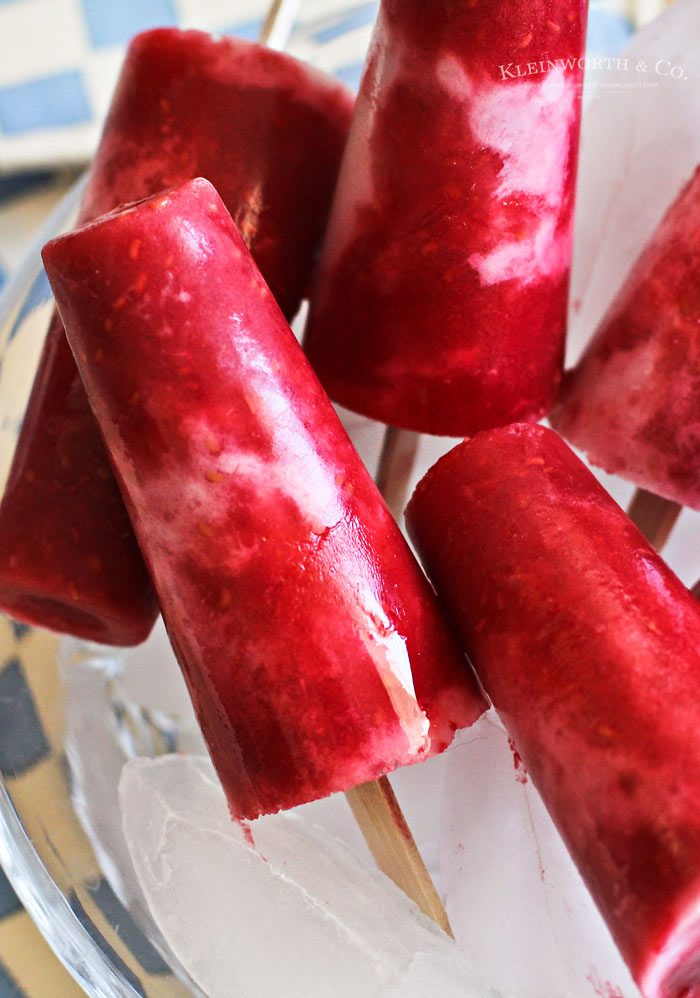 These Raspberry Coconut Pops are so incredibly easy & delicious! The perfect blend of raspberry & coconut in a cool & refreshing pop.