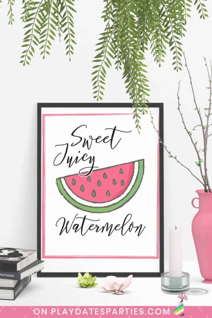 Art print on a table that has a picture of a wedge of watermelon with the words sweet juicy watermelon