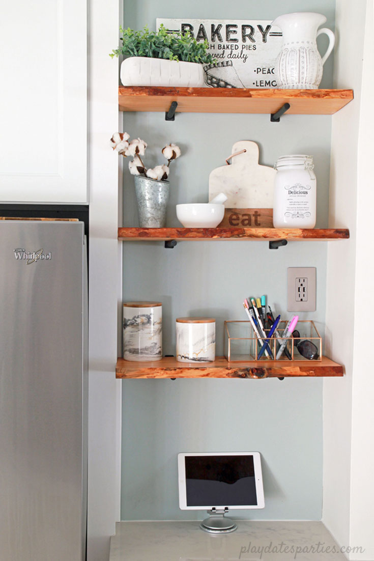 Turn an awkward space into prime real estate. The custom fit cabinet, #DIY live edge wood #shelves, and grey paint turned an eyesore into feature in the #design of this small white kitchen. 