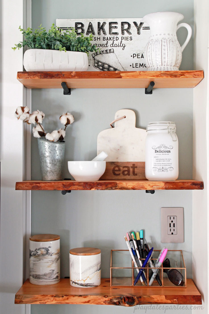 Turn an awkward space into prime real estate. The custom fit cabinet, #DIY live edge wood #shelves, and grey paint turned an eyesore into feature in the #design of this small white kitchen. 