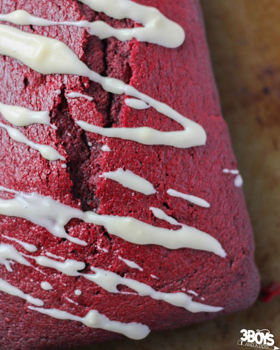A Loaf of Red Velvet Quick Bread with Icing Drizzled on Top