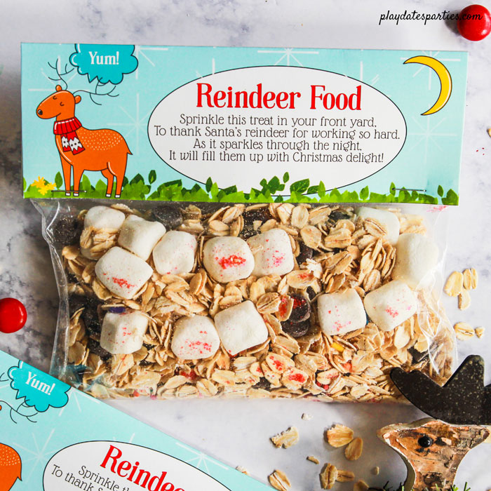 Reindeer Food printable bag topper with a bag full of oats, sprinkles, marshmallows, and chocolate chips