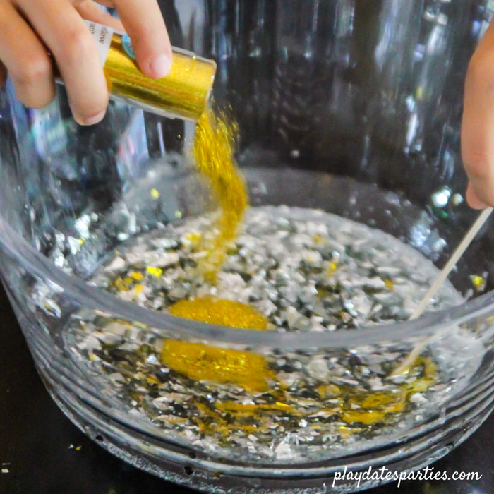 Even full of glitter and confetti, you can see how clear this slime recipe (no borax) is.