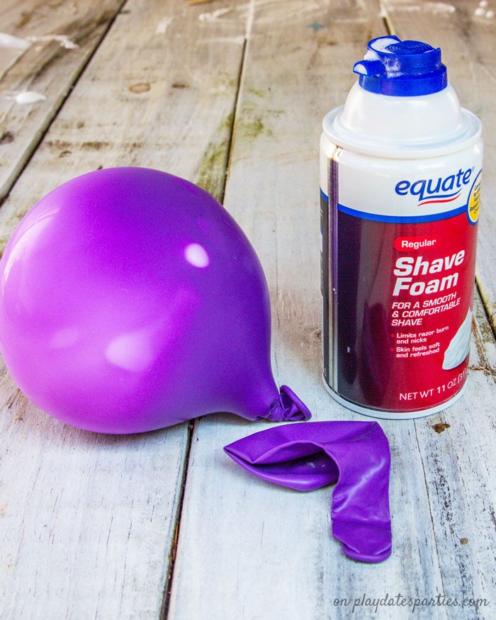 A balloon filled with shaving cream next to a can of shaving cream