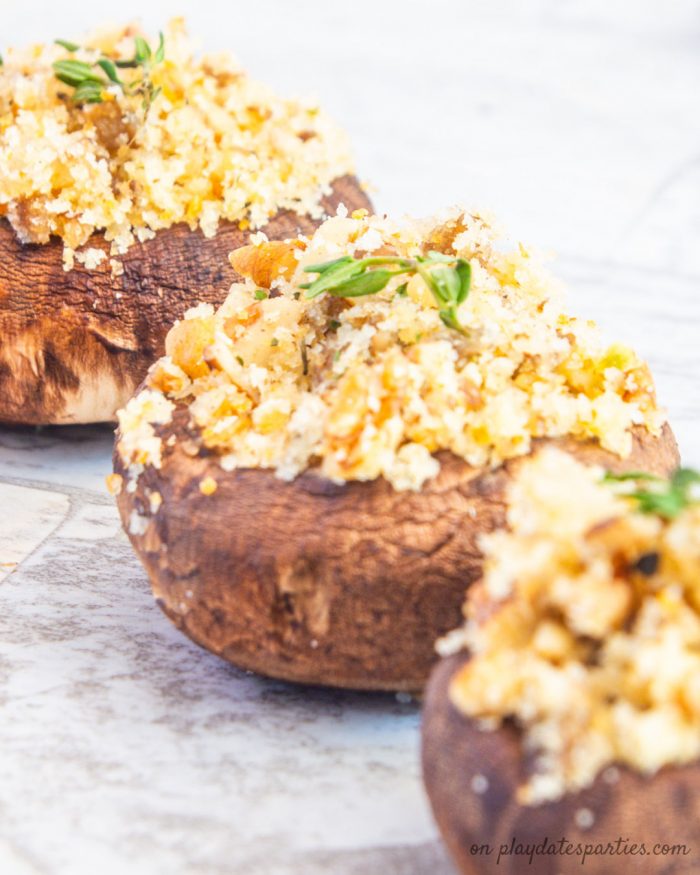 closeup of stuffed mushrooms filled with pecans and breadcrumbs