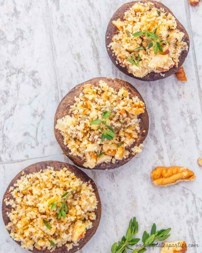 easy stuffed mushrooms with pecans and thyme on a table