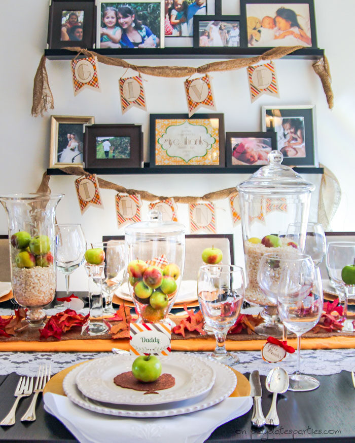 Thanksgiving decorations with vintage lace, fresh apples, burlap, and party printables