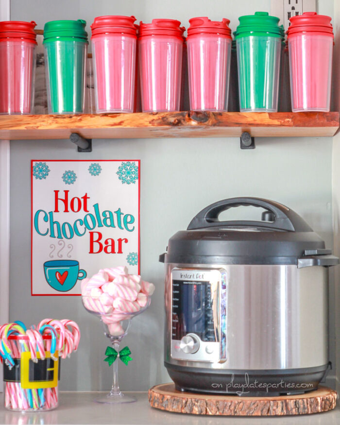 Hot chocolate bar with candy canes, marshmallows and dollar tree coffe mugs