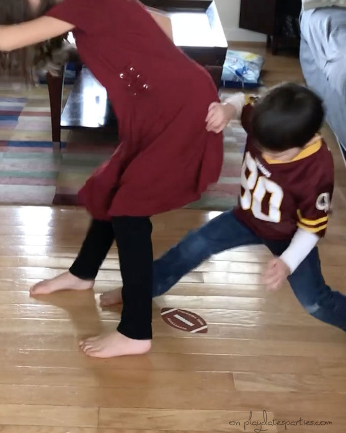 kids playing touchdown tango football party activity