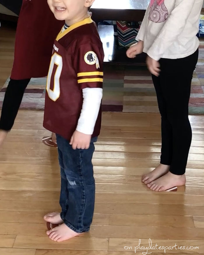 kids waiting to start playing football themed party activity