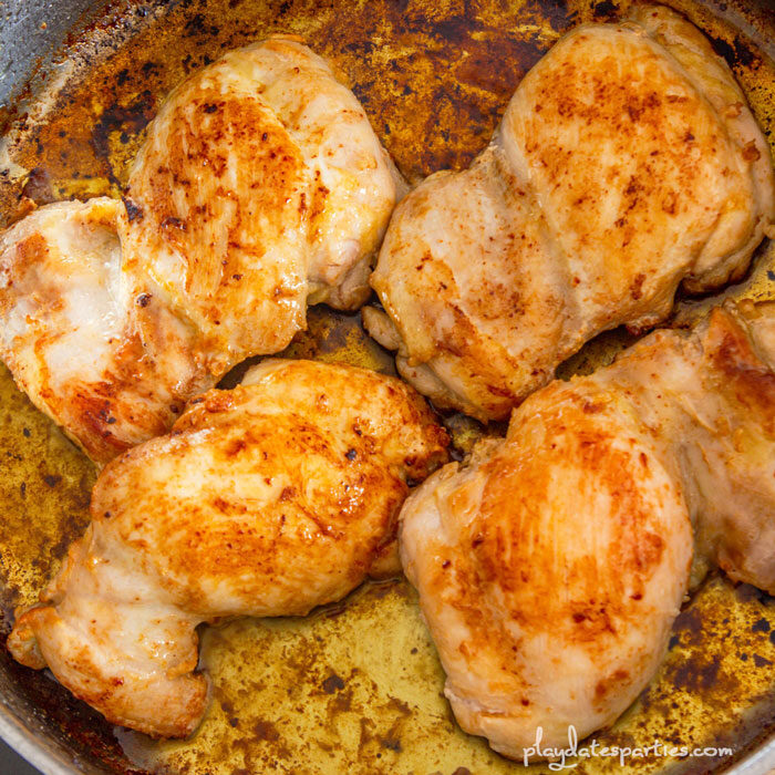cooked chicken thighs in a skillet