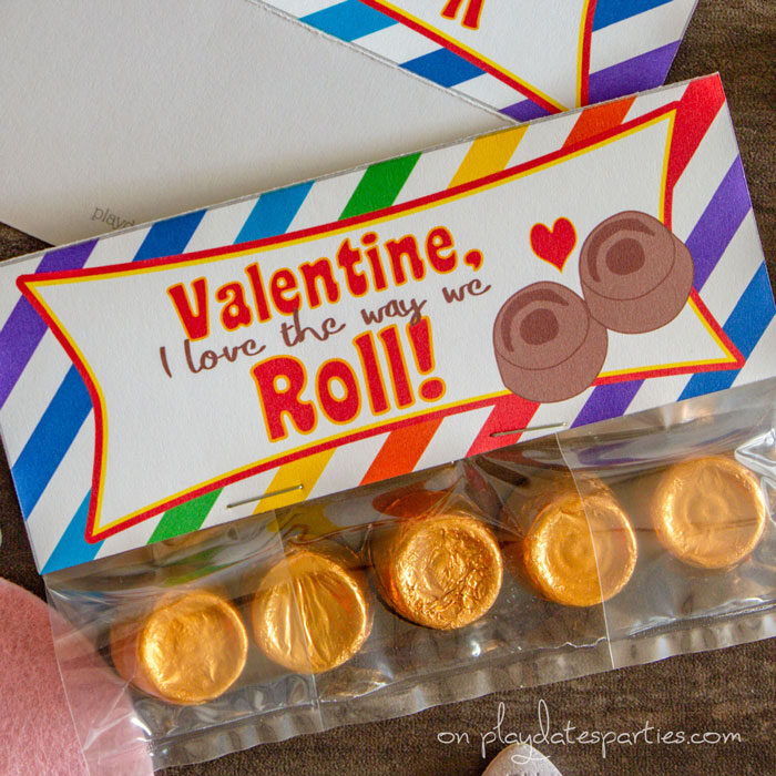 close up of treat bag topper with rainbow background and the text Valentine I love the way we roll