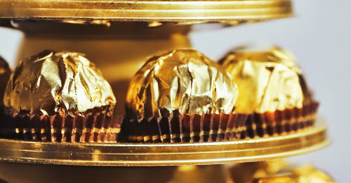 close up of ferrero rocher gold wrapped candies