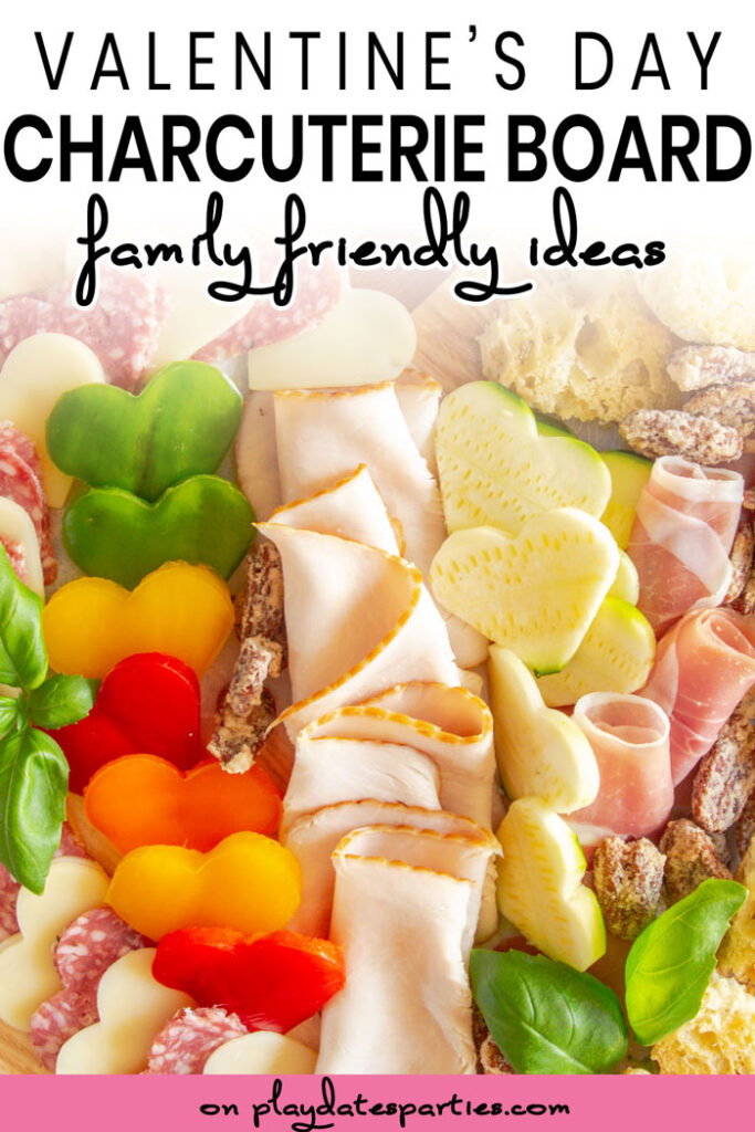  close up of a charcuterie board with heart shaped vegetables with the text Valentines Day charcuterie board family friendly ideas