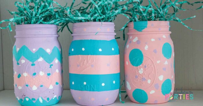 Easter egg mason jars painted in zig zags stripes and polka dots