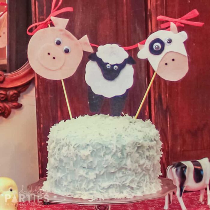 coconut cake with a felt farm animal topper