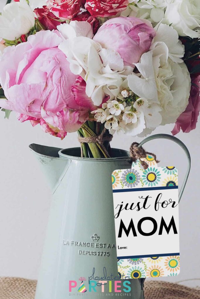 pitcher with spring flowers and a Mother's Day gift tag