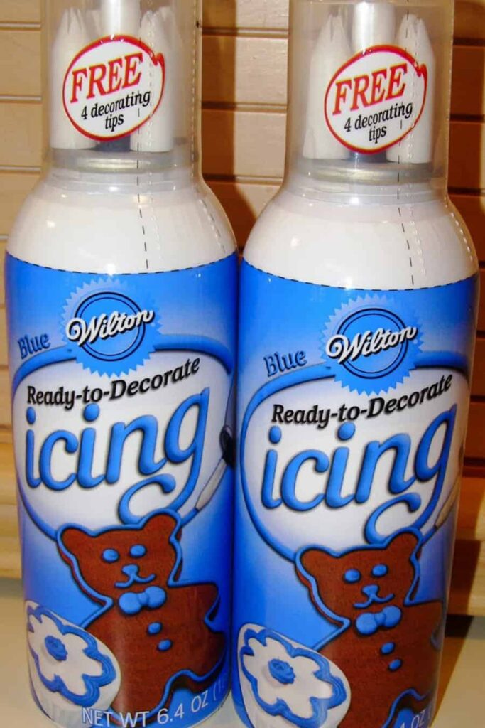 2 cans of blue wilton ready to decorate frosting with tips