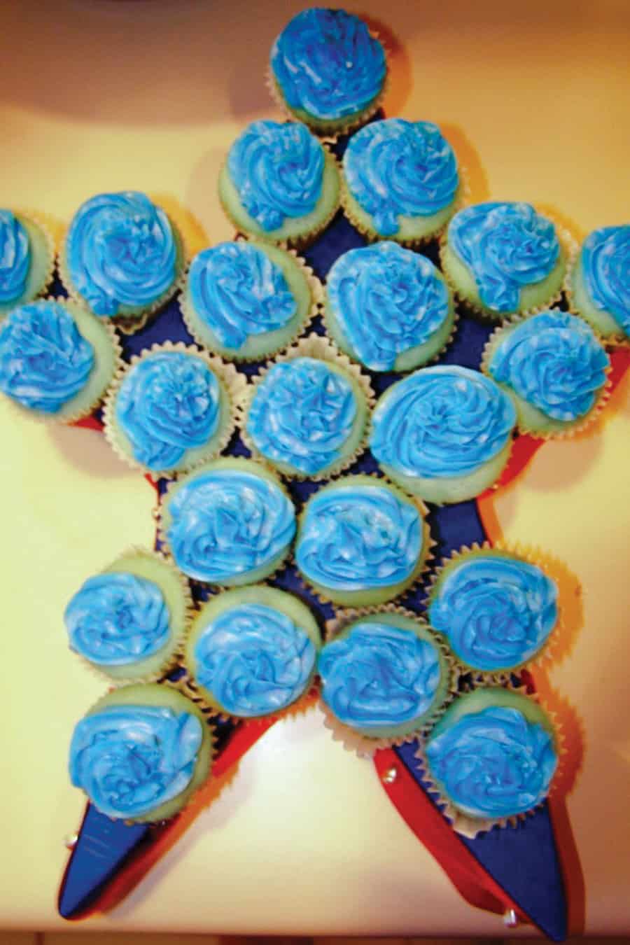 cupcakes arranged in a star shape with blue frosting
