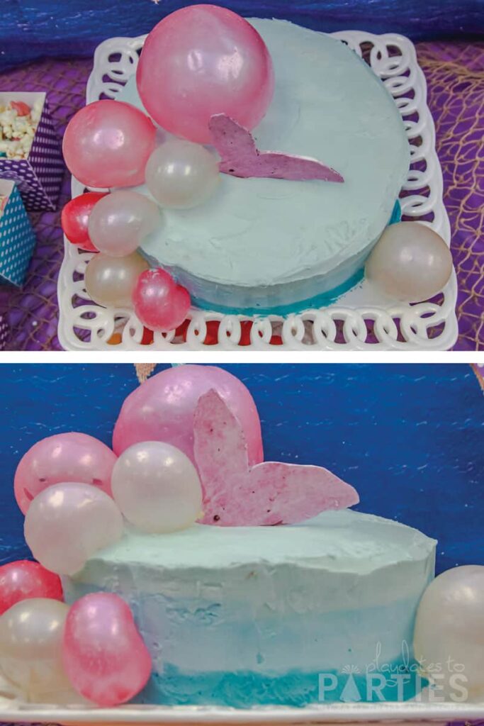 blue ombre birthday cake with pink gelatin bubbles and a purple mermaid tail coming out