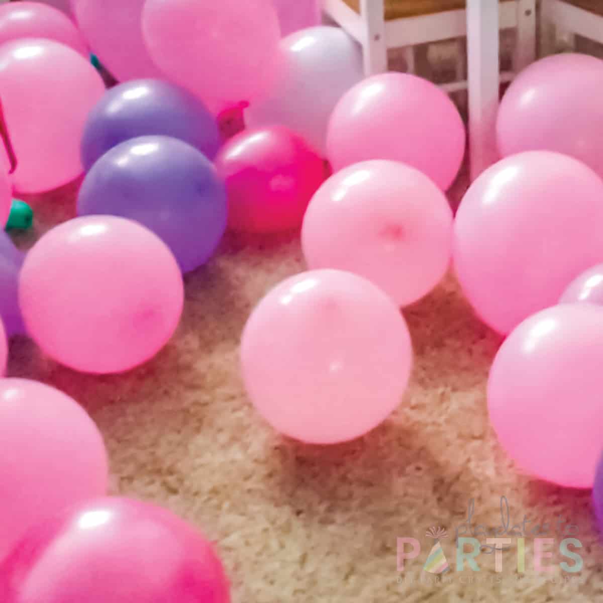 floor covered with balloons