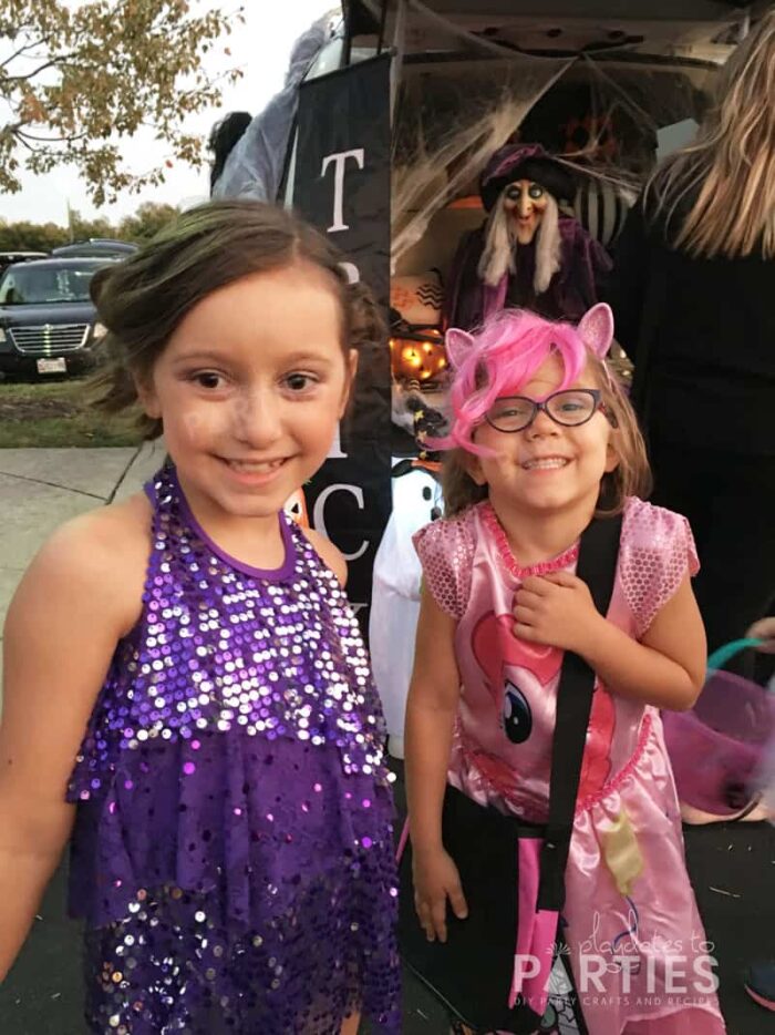 Kids trick or treating dressed as a dancer and as Pinkie Pie