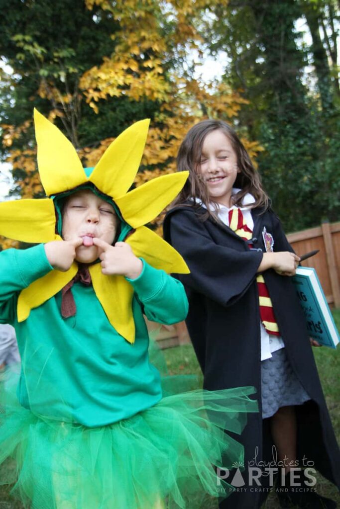 Children dressed as a sunflower and as Hermione for Halloween